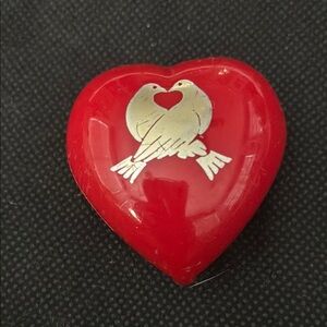 Avon Loving Heart solid perfume in a red plastic heart box with turtle doves.